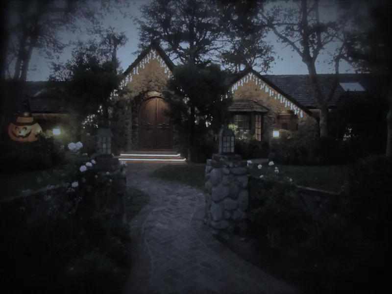The front path of the manor lit for Halloween